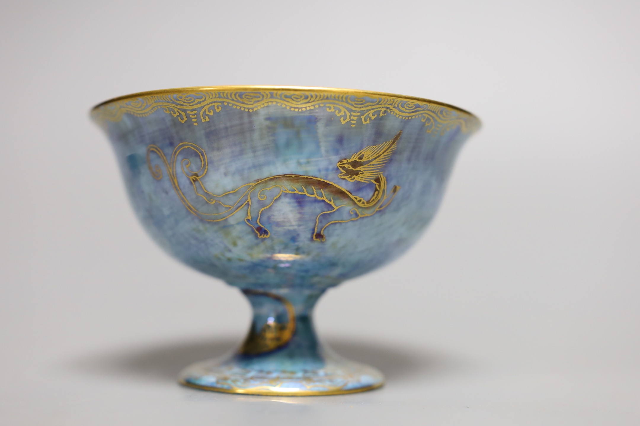 A Wedgwood blue lustre chinoiserie pedestal bowl, designed by Daisy Makeig Jones, pattern number Z4829, 8 cms high